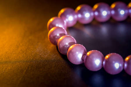 Pearl necklace isolated on dark backgroundの写真素材