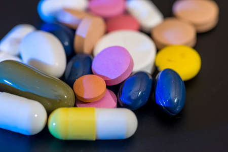Pharmacy background - pills isolatedon a blackの写真素材