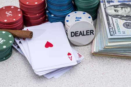 poker chips and play card with sigar and moneyの写真素材