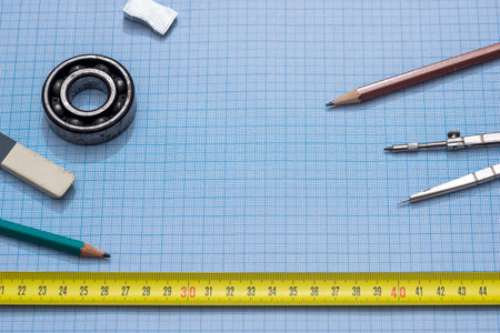 blue graph paper with drawing tools