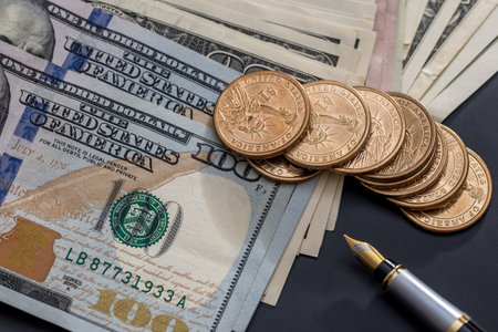 Finance concept - money, coin and bills and pen