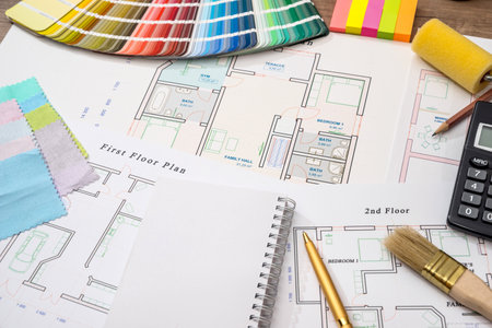 Color samples with house plan, calculator and penの写真素材
