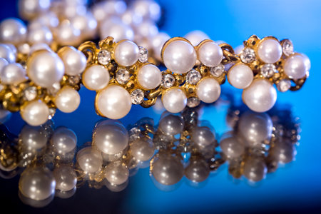 White pearls collier isolated on black blue background.の写真素材