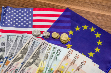 Dollars and euro with flag in table