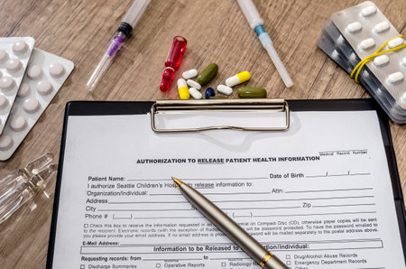 Prescription form lying on table with pills and syringes