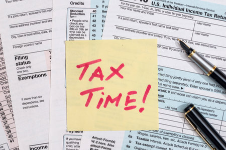 tax time. tax form with money. penの写真素材