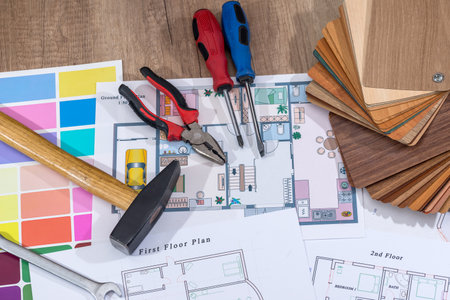 architectural plan house with wooden samples and work tools.