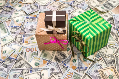 gift box above dollars bills as background