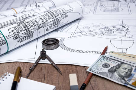 The drawing machine, pencil, ruler, us dollar and compassesの写真素材