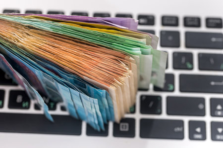euro money on laptop. close up