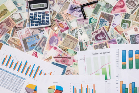 business graph with world paper currencyの写真素材