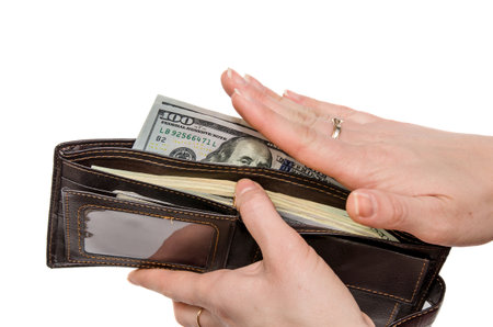 wallet with dollars in the woman hands isolated