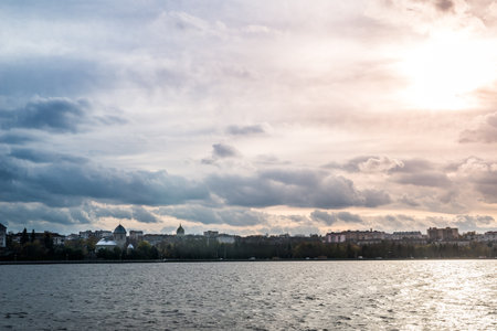 dramatic sunset sky at the lake in cityの写真素材
