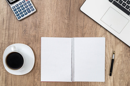 workspace - cup of coffee with laptop and blank sheetの写真素材