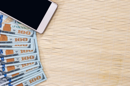 dollar banknote with phone. business conceptの写真素材