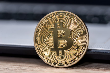 new currency - bitcoin on white laptop keyboardの写真素材
