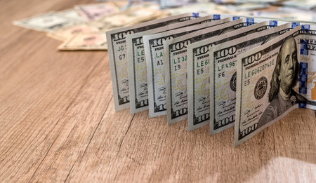 One hundred dollars on desk. close upの写真素材