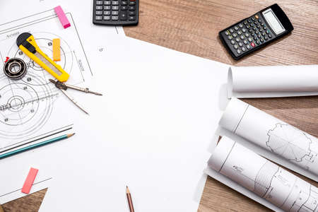 measuring tools on the background of technical drawings. view on top