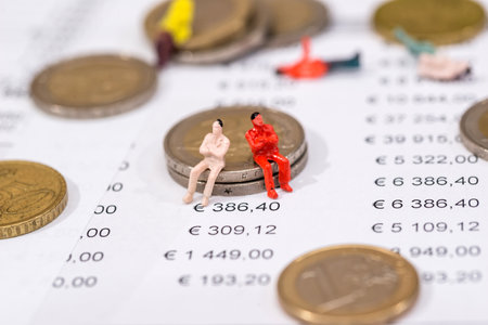 amsll toy people with euro coin and business graph.の写真素材