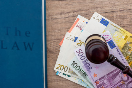 gavel and euros money on wooden table. close up.の写真素材