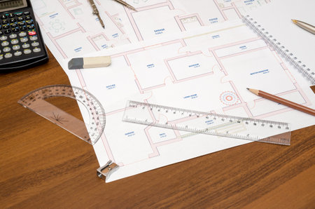 architectural plan of the building with the tools on the tableの写真素材