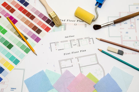 architectural drawing with paintbrush, color sample and working toolsの写真素材