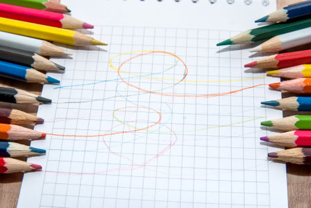 Colored pencils and paperの写真素材