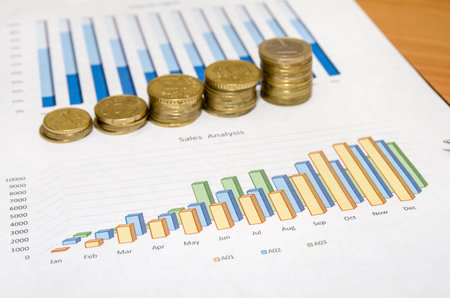 Graph and money coins on the table