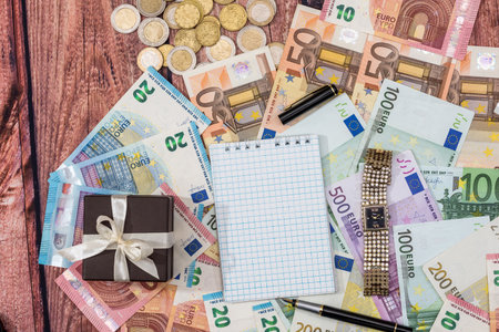 Gift box with euro, pen and blank notebook.の写真素材