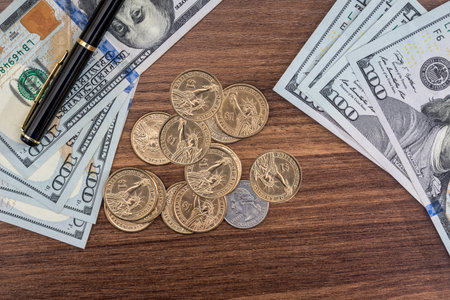 dollar coin and bills, pen.の写真素材