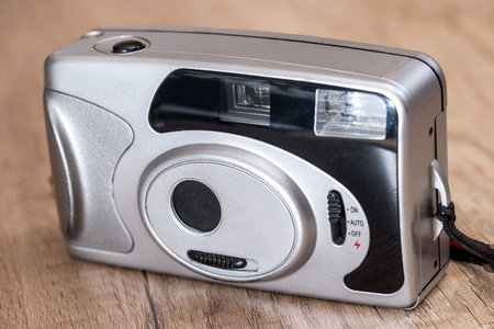 Old camera on wooden background. close up.