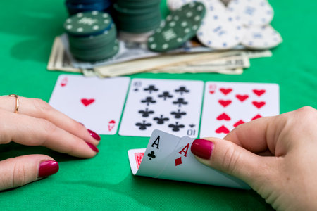 Woman in casino with two aces