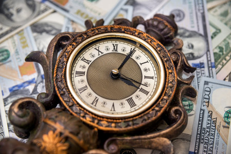 retro clock with dollarの写真素材