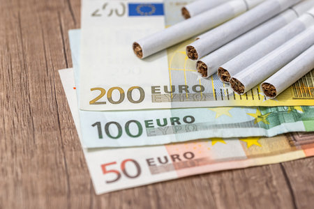 Euro banknotes with cigarettes on the tableの写真素材