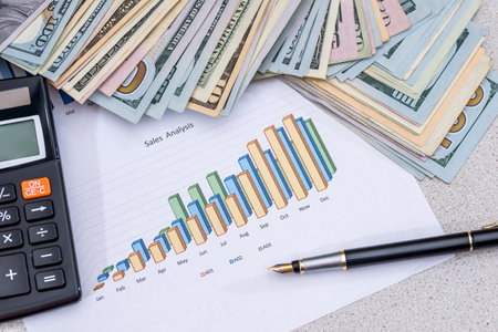finance concept - money, graph, pen and calculatorの写真素材