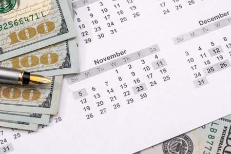 dollars with calculator on the calendar 2017.