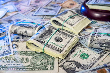 Auction concept - judges gavel against us dollar background.の写真素材