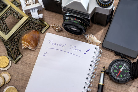 summer traveling stuff - notepad, pen, camera, compass, eiffel tower, phoneの写真素材