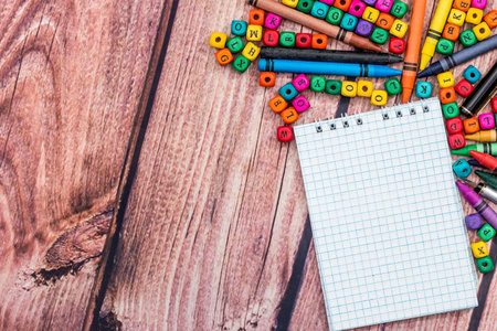 school concept - empty notepad with color pencil and cubes.の写真素材