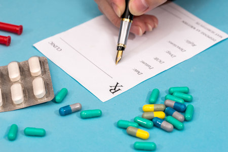 medical concept - rx blank, cardiogram, pills and syringeの写真素材