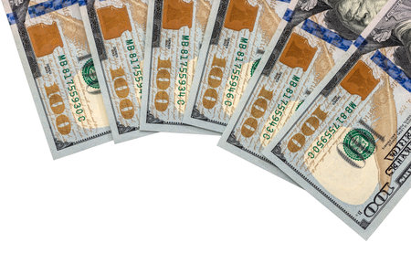 Isolated hundred dollar bills on a white background