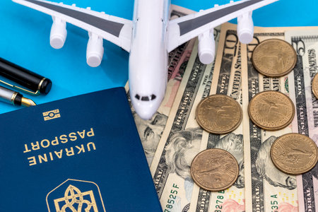 Travel concept - plane, money and passportの写真素材