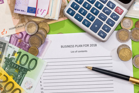 2018 new year goals with euro, pen and calculatorの写真素材