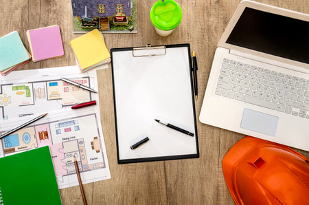 architectural plan of the house, laptop, helmet, layout, folder
