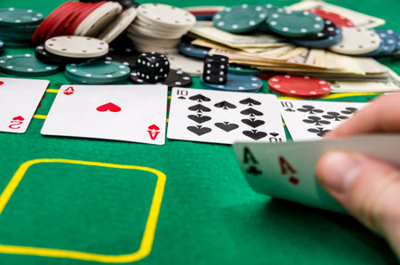 Man's hand showing card combination, gambling.
