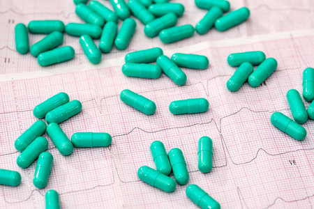 Green pill on the cardiogram. close upの写真素材