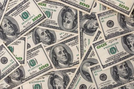 many 100 dollar banknotes as background