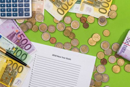 2018 new year goals with euro, pen and calculator