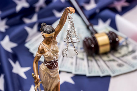 Law concept - femida, dollar, gavel and flag
