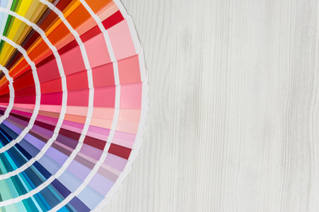 Color guide on light wooden background, top viewの写真素材